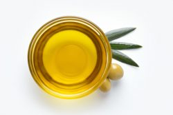 Glass,Bowl,With,Olive,Oil,On,White,Background