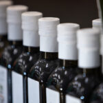 Rows,Of,Olive,Oil,Bottles,In,Diminishing,Perspective