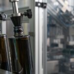 Close-up,Of,Dark,Glass,Olive,Oil,Bottles,With,Metal,Dispenser