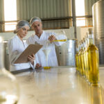 Technicians,Examining,Olive,Oil,In,Factory