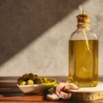 Olive,Oil,Bottle,With,Olives,And,Garlic