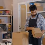 Young,Manager,In,Post,Room,Packing,Order,For,Distribution.,Online