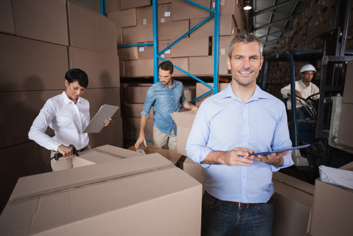 Warehouse,Manager,Using,His,Tablet,Pc,In,A,Large,Warehouse